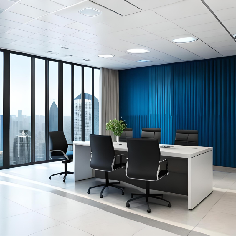 Modern furnished office with desks, chairs and large windows.