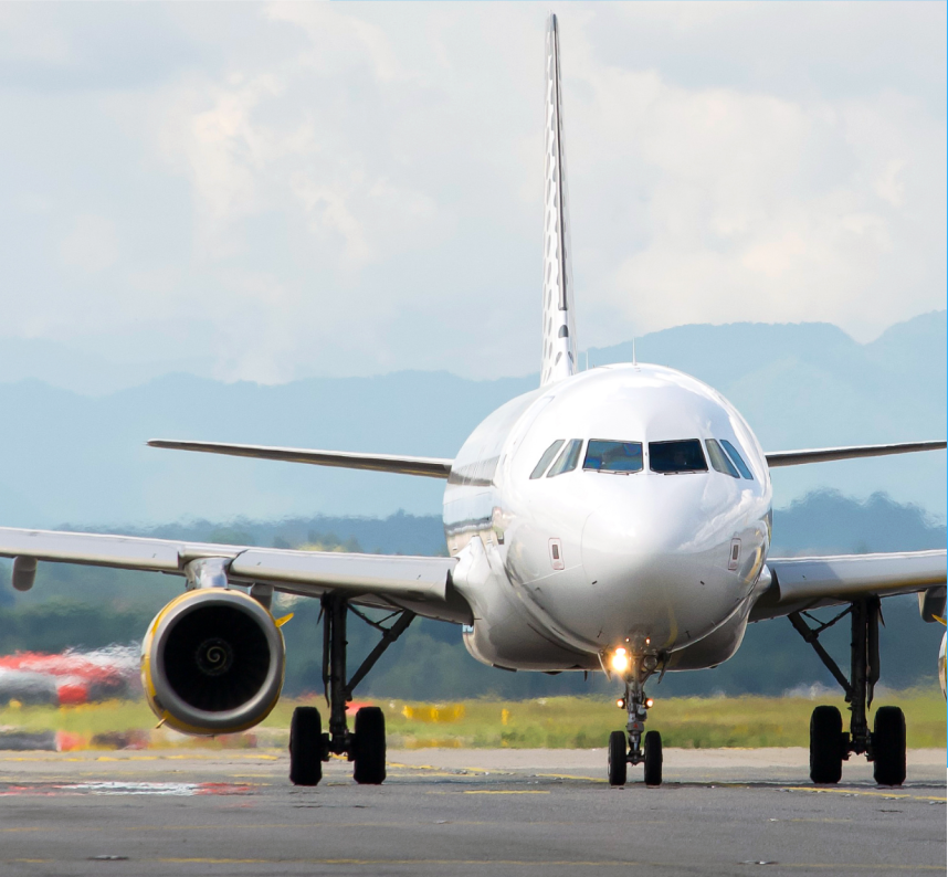 Passenger aircraft viewed from the front on an airport taxiway.