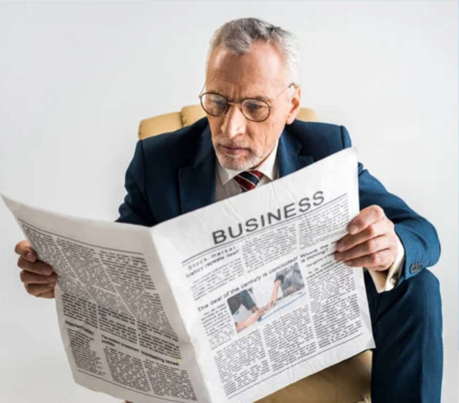 Man reading a business newspaper.