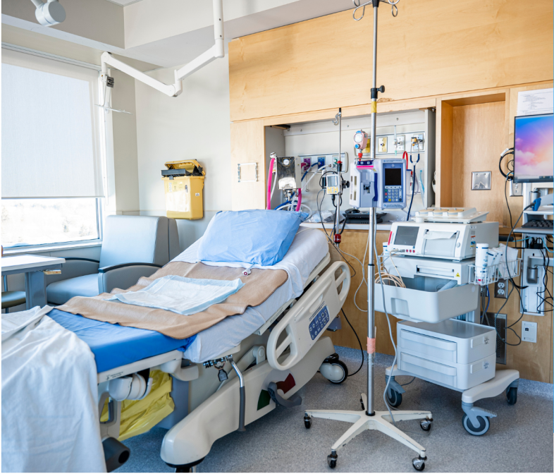 Hospital bed with monitoring equipment and medical devices.